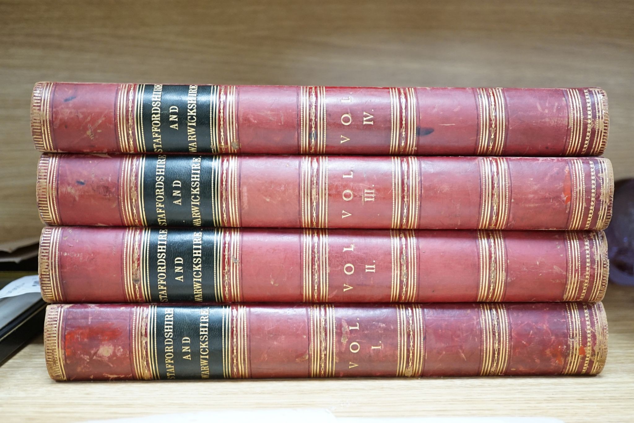 Langford, John Alfred & Others - Staffordshire and Warwickshire, Past and Present, 2 vols (in 4), 28 portraits and plates, 2 coloured maps, red half calf and cloth, gilt-decorated panelled spines, quarto, (1870)